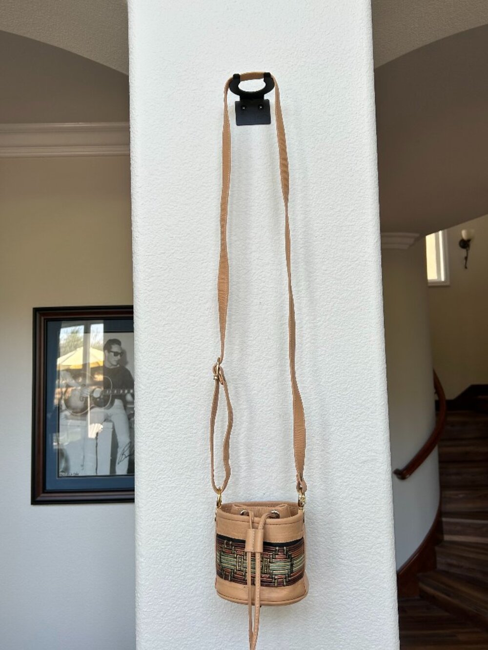 Small ASHRO tan leather bucket-style crossbody bag with drawstring closure